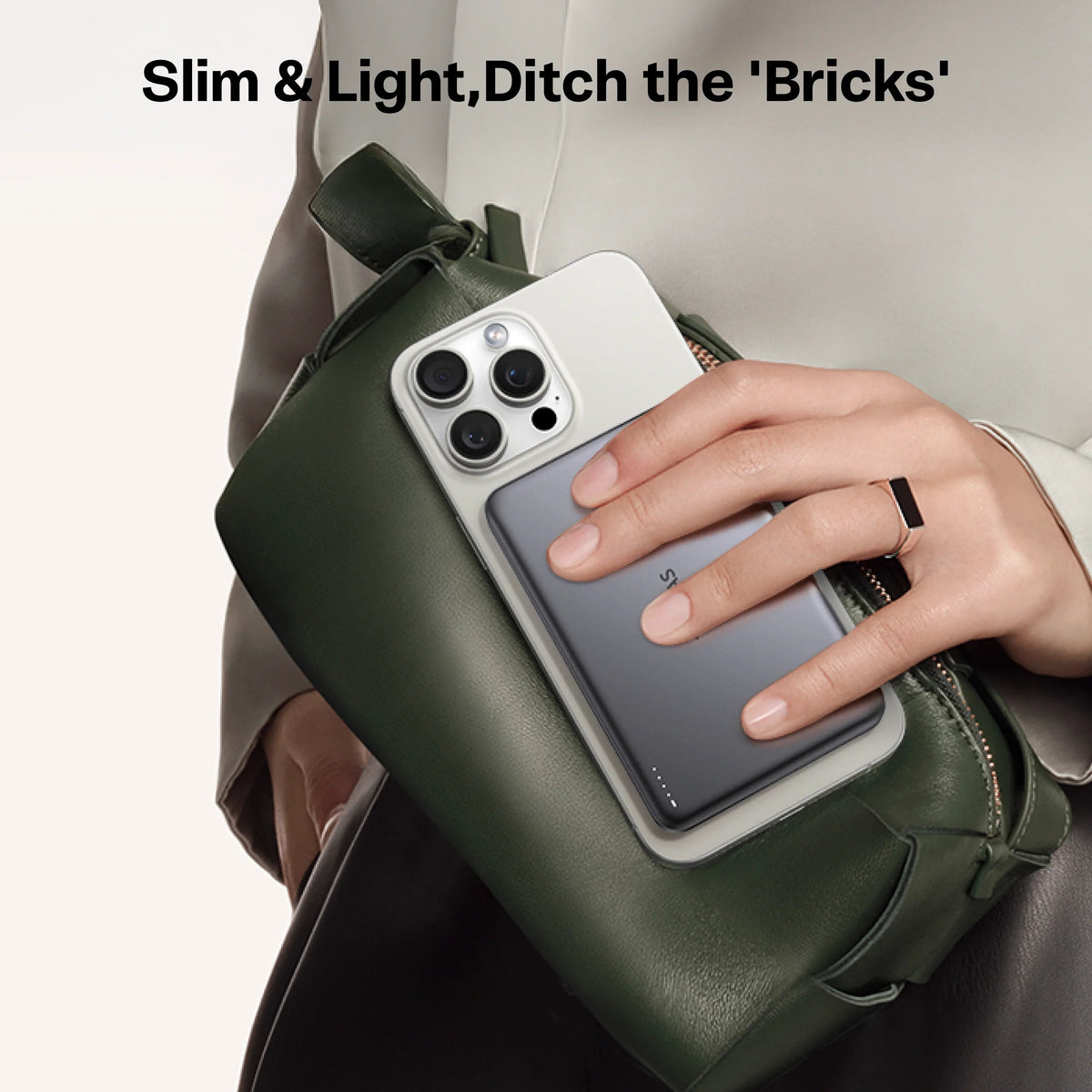 Slim & Light TORRAS MiniMag Power Bank shown with phone and green purse.