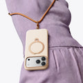 TORRAS Ostand Q3 beige silicone iPhone 17 Pro Max case with wood grain texture, magnetic stand, lanyard.
