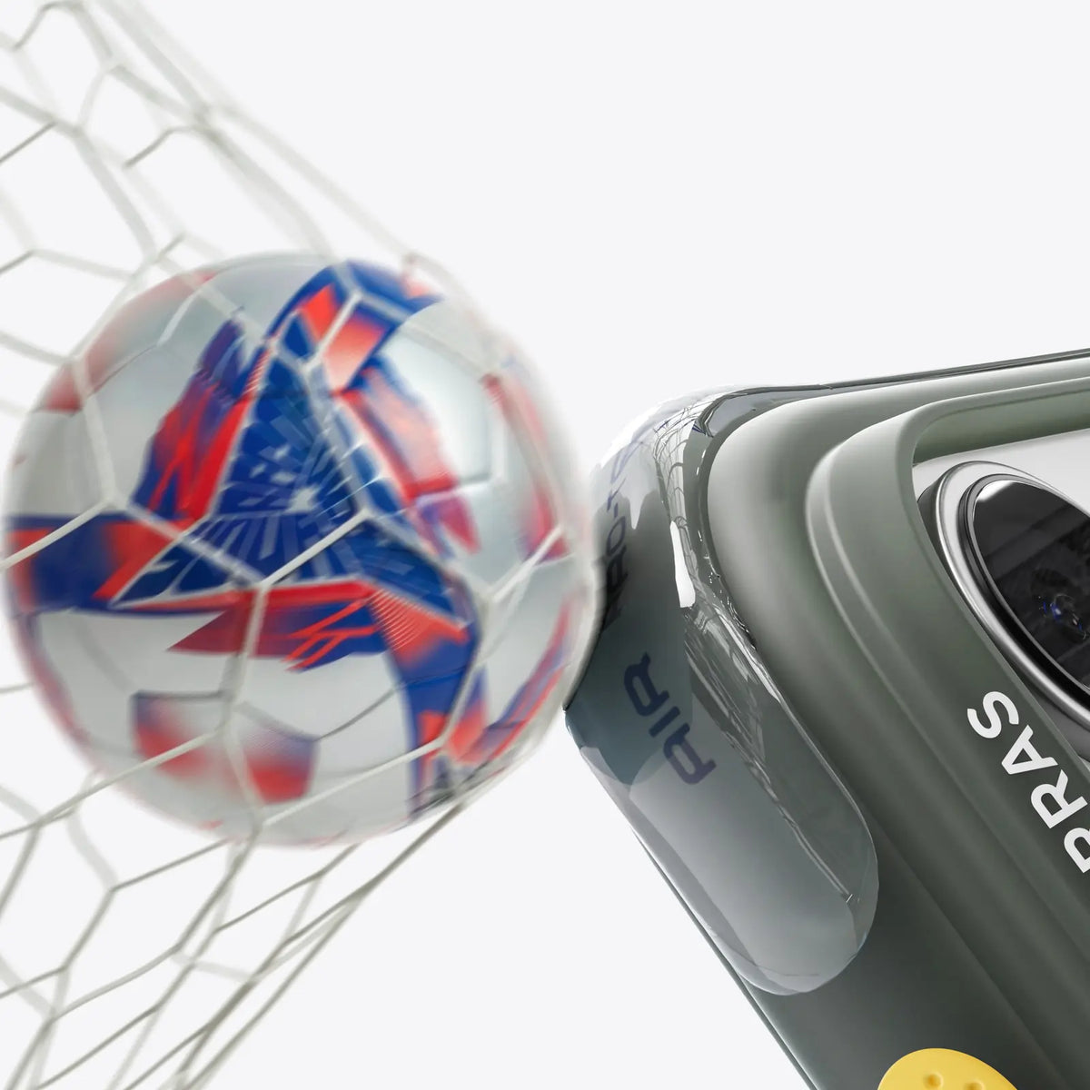 Soccer ball hitting the net beside a TORRAS Ostand Q3 Air case