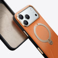TORRAS Ostand Q3 VegSkin textured orange case for iPhone 17 Pro Max with gold stand.