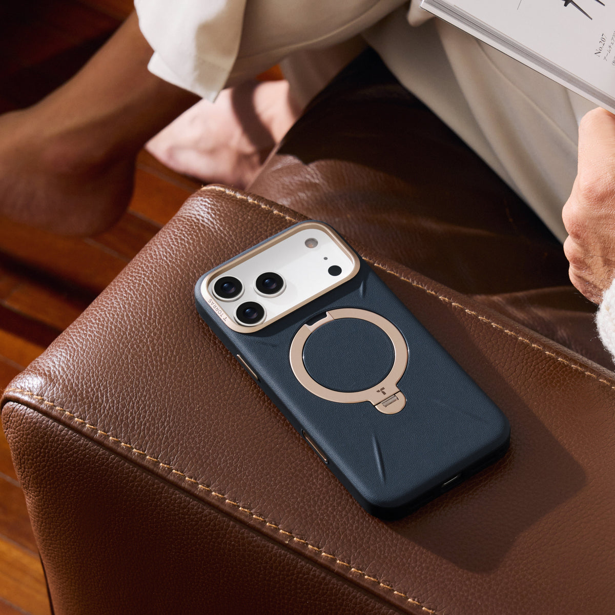 TORRAS Ostand Q3 VegSkin dark blue iPhone 17 Pro Max case with magnetic ring stand.