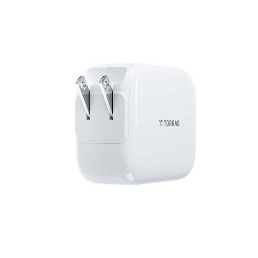 White TORRAS 67W fast charger with foldable US prongs and minimalist design.