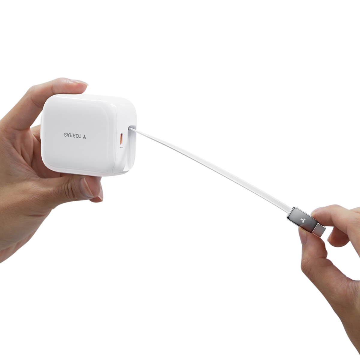 Hands extending white TORRAS 67W retractable fast charger USB-C cable.